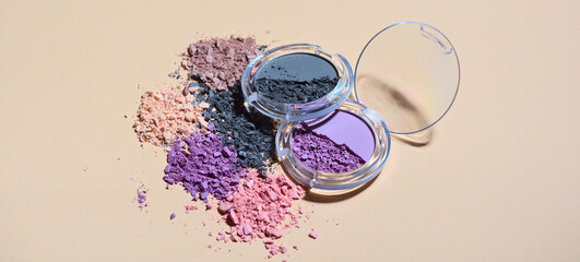 Creative concept photo of cosmetics beauty eyeshadow on beige background