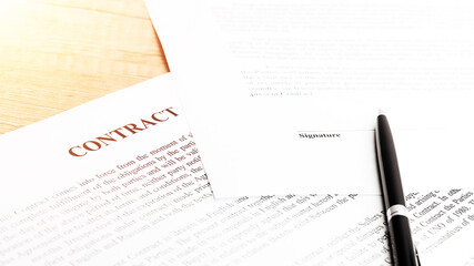 Legal contract signing - buy sell real estate contract. Close up.