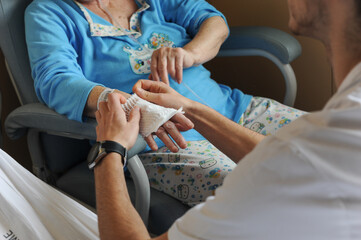 Obraz na płótnie Canvas A nurse takes care of a patient in the hospital
