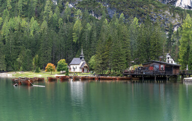Fototapeta na wymiar Pragser Wildsee Church Boats Dolomites