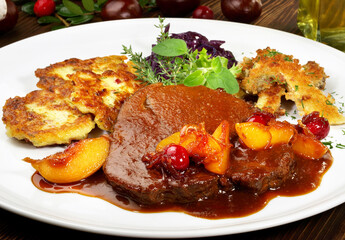 Roasted Deer Haunch Slice with Potato - caramelized Cranberries and Apricots