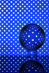 glass ball on an abstract geometric background