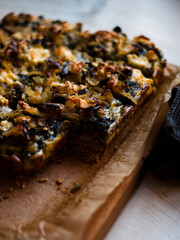 Rustic farmhouse spinach quiche in natural light
