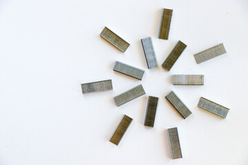 Paper staples pile on the white background