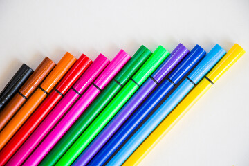 Colorful markets gradient on the white background, markers for painting and drawing