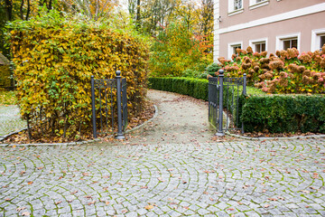 Park, autumn, shrubbery, stone pavement, gate.