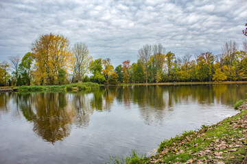 Landscape, view of the lake and trees, cloudy sky, overcast.