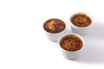 Homemade creme brulee in bowl isolated on white background.Copy space
