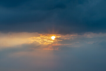 Beautiful sunset sky above clouds with dramatic light, Beautiful blazing sunset landscape, Horizon. Warm Colours, copy space.