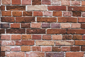 Fototapeta premium wall of brown and red bricks, loft interior