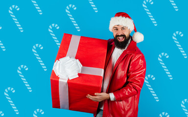 Present box. Christmas Santa. Delivery gifts. New year gift. Christmas decorations. Santa Claus hold big present. New year gift.