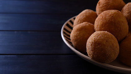 Arancini, Italian street food made of rice, meat and vegetables .