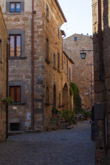 Fototapeta na wymiar Civita di Bagnoregio is one of the most beautiful and characteristic Italian villages with corner of a quaint hill town, tiny alleys with the typical low-rise houses,typical of Medieval architecture.