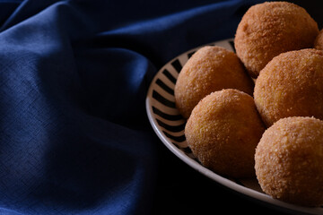 Arancini, Italian street food made of rice, meat and vegetables .