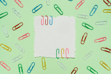 Creative concept colorful paper clip with a copy space