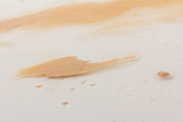 Texture of liquid foundation Background made of liquid foundation Make-up concept. Skin Tone Cream