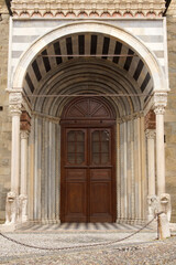 Fototapeta na wymiar Bergamo (Italy). Architectural detail of access door in the Basilica of Santa Maria Maggiore in the city of Bergamo