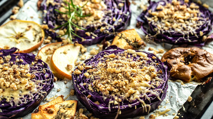 Traditional German dish of red cabbage baked with nuts, quince and apples, chef cooking autumn dish of red cabbage baked