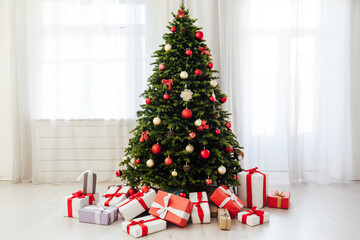 Stylish Christmas light interior with a soft armchair or sofa decorated with garland. Comfort home.