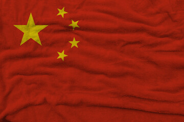 National flag of China on fabric texture.