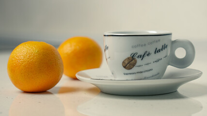 Cup of coffee with tangerines