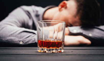 son holding a glass of whiskey