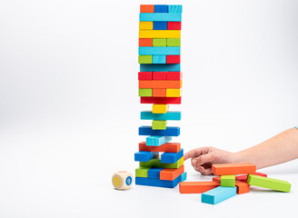 Fototapeta na wymiar Tower game. Family Game Colored Wooden Cubes