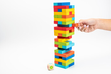 Fototapeta premium Tower game. Family Game Colored Wooden Cubes