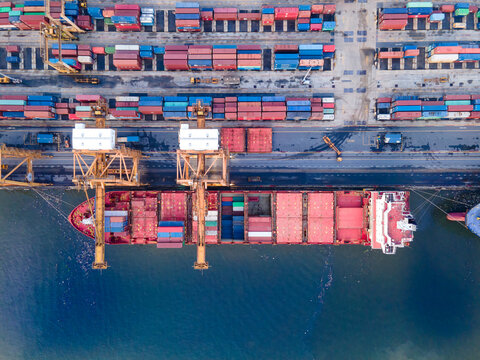 Aerial view of container ship loading and unloading in deep port, Container loading cargo freight ship maritime