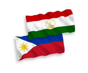 National vector fabric wave flags of Tajikistan and Philippines isolated on white background. 1 to 2 proportion.