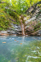 Fototapeta na wymiar beautiful rocky waterfall in the forest