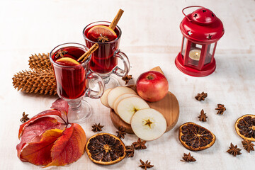 Christmas magic atmosphere, home celebration. Hot mulled wine, spices and festive decorations. Winter holidays celebration concept