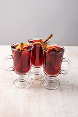 Christmas magic atmosphere, home celebration. Hot mulled wine, spices and festive decorations. Winter holidays celebration concept