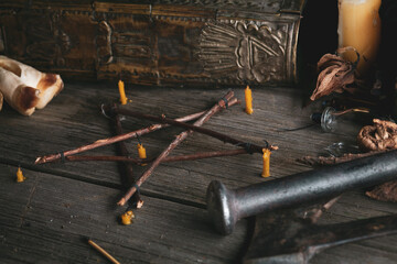 Branch Pentagram - witchcraft tools of natural wood. Esoteric still life with elements of pagan...