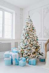 Christmas tree decoration at home interior with blue gift boxes