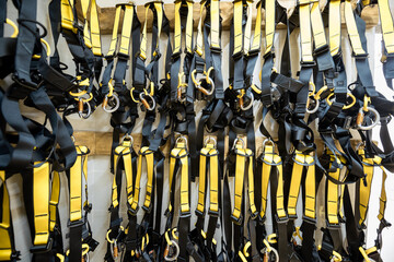Professional climbing equipment hanging at amusement park warehouse