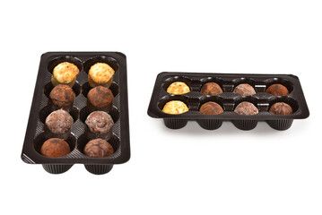 Chocolate candy collection in plastic box.