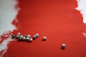 Beads on a red background whith space for text.