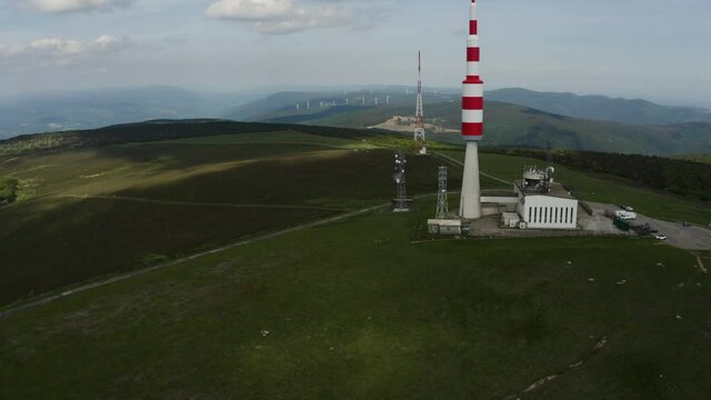 Big red and white Aerial on top of a mountain. Pic de Nore, sum of the black mountain, radar, parabol
