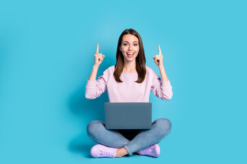 Full size photo of positive girl sit floor legs crossed work remote laptop demonstrate social...