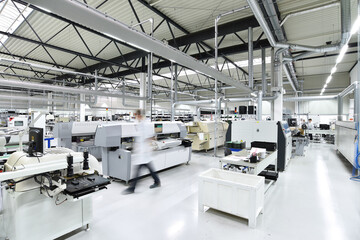 modern industrial factory for the production of electronic components - machinery, interior and equipment of the production hall - obrazy, fototapety, plakaty