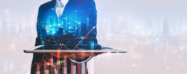 Business man using tablet on futuristic network and digital marketing city technology background