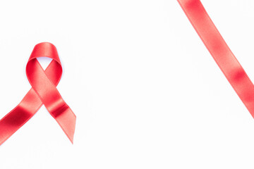 Aids day. Red ribbon symbol in hiv world day isolated on white background. Awareness aids and cancer. Healthcare and medical concept.