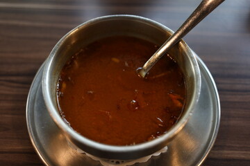 South Indian Dish Dosa Rasam served on Table with Banana Leaf on Plate