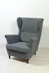 armchair with backrest stands on white background