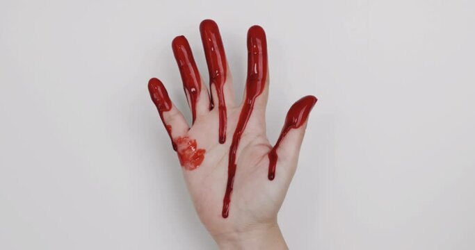 Female Bloody hand and dripping down on white background.