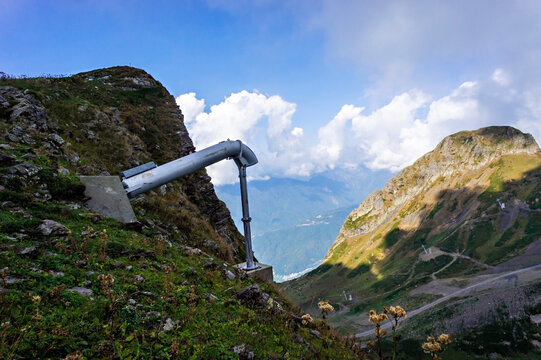 Avalanche exploder in the Caucasus Mountains, Aibga ridge against the background of a cloudy sky, summer landscape, Avalanche control system