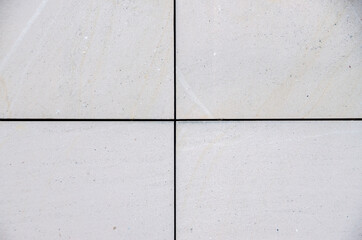 bright smooth modern sandstone facade with an regular pattern