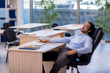 Young male teacher in the classroom