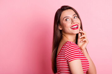 Close up profile portrait of attractive person arm on chin look empty space isolated on pink color background